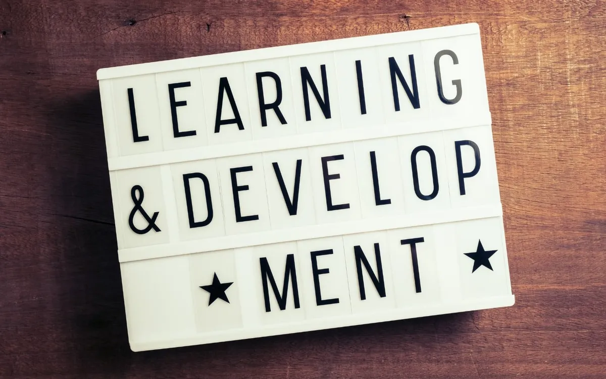 A lightbox sign reading Learning and Development