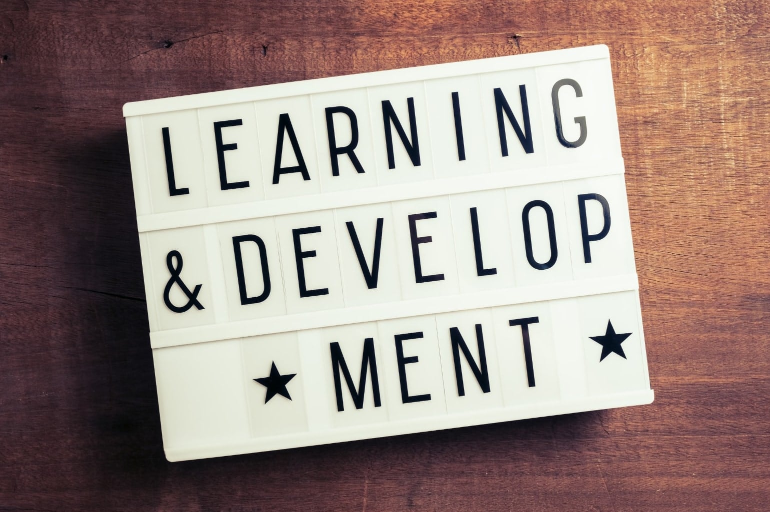A lightbox sign reading Learning and Development